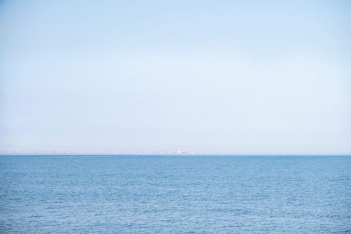 a nuclear power plant in the distance