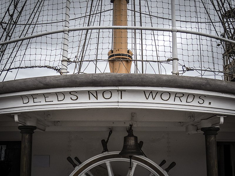 DEEDS NOT WORDS